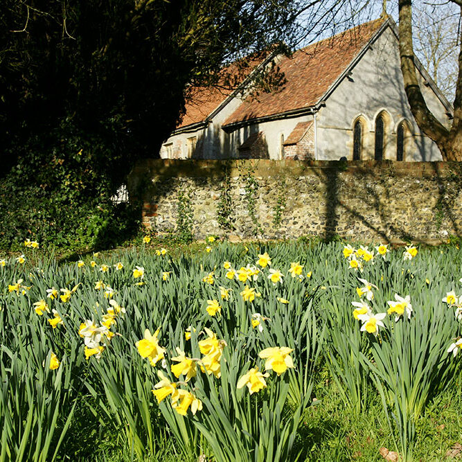Looking at the church beyond the stone wall